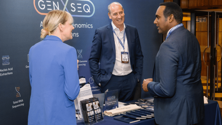 Attendees taking part in a roundtable networking session at a professional industry conference